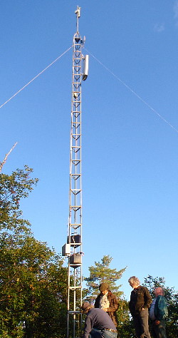 Friends examining the new tower with all 3 antennas